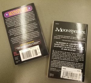 Back covers of two editions of K.D. Wentworth's book Moonspeaker that shows the changes between the versions