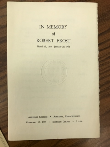 The front cover for a program from Amherst College stating "In Memory of Robert Frost" on the cover