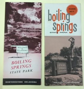 Two brochures for Boiling Springs State Park, one with a woman standing on a sign and looking off to the left and the other of the landscape in the park