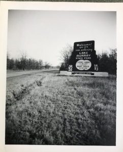 Photograph of a wooden sign announcing Lake Murray State Park