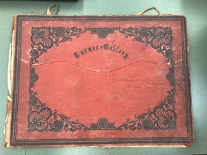 Red leather cover with black decoration with the words "Turner Gallery" in the center